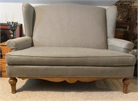 Green and Tan Loveseat with Wooden Legs