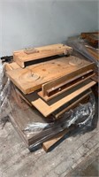 Pallet  of wooden music instrument case molds.