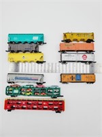 10 assorted model train cars