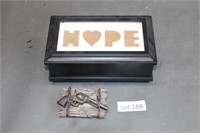 small jewelry storage box and revolver plaque