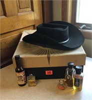 Cowboy hat, cologne bottles