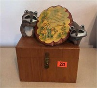 Wooden box, raccoon statues, wall plaque
