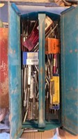 Metal tool box full of taps