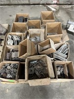 Pallet of metal brackets and components