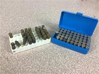 48 - 38 caliber spent cartridges, 13 - 38 ACP