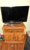 TV Stand, TV, 2 Suitcases