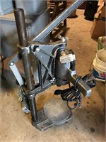 Porter Cable electric drill attached to stand