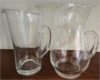 M - PAIR OF GLASS PITCHERS (L48)