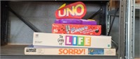 4 assorted board games- Uno attack, encore, the