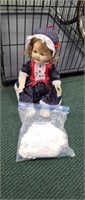 Antique doll with clothing
