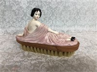Vintage vanity brush reclining lady figure
