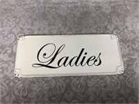 Metal ladies bathroom sign