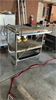 cart on casters and 3 metal shelves