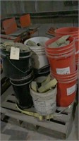 pallet of buckets full of ratchet straps