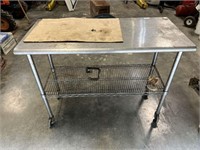 Rolling stainless cart/table, 49 1/2” x 24” deep