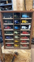 21 toy cars in display case