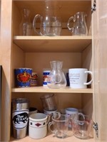 3 shelves of glasses pitchers and more