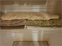 Bath mats and a shower liner