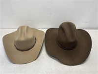 Justin cowboy hat and a Serrratelli cowboy hat