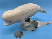 Dennis Pungowiyi ivory carving of a beluga whale w