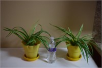 (2) faux plastic plants in planter vases