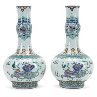 PAIR OF CHINESE DOUCAI VASES WITH GUARDIAN LIONS