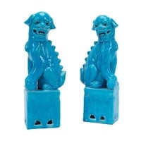 PAIR OF CHINESE TURQUOISE GLAZED OPPOSING FU LIONS