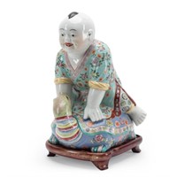 CHINESE CERAMIC BOY RIDING A TURTLE W/STAND