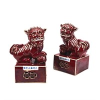 PAIR OF CHINESE SANG DE BOEUF FU LIONS
