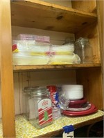Cabinet full of Holiday Paper Plates Napkins Jars