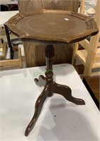 Small vintage leather top side table with a