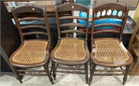 Three antique similar matched side chairs with