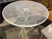 42 inch white metal patio table with a hole in