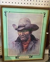 Framed print of a cowboy with the following