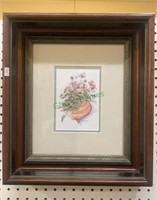 Antique shadowbox frame with a seashell and