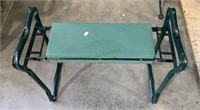 Portable green metal work seat, great for the
