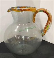 Large blown glass pitcher with multicolored rim
