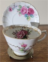 Vintage hand painted cup and saucer