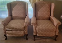 Pair of pink wing back reclining chairs