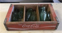 Coca Cola wood crate with empty bottles