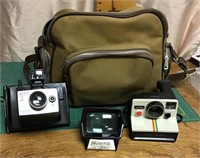 2 Polaroid cameras with bag