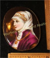 Cameo pin on porcelain