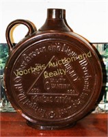 Canteen style brown glaze jug, "Quinn's