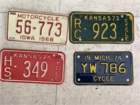 4 vintage motorcycle license plates.