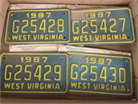 4 old motorcycle license plates.