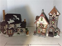 2 lighted Christmas houses.