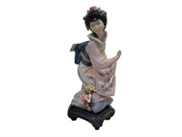 Lladro Porcelain Figure of Woman With Flowers