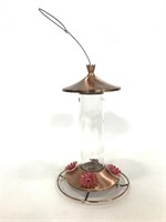 Metal and glass hummingbird feeder