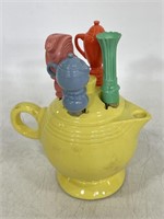 Yellow Fiestaware mini tea pot with cheese knives