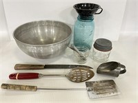 Mixing bowl with assorted kitchen utensils